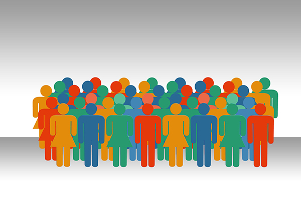 Eine Gruppe von farbig unterschiedlich gestalteten menschlichen Figuren, die beieinander stehen.